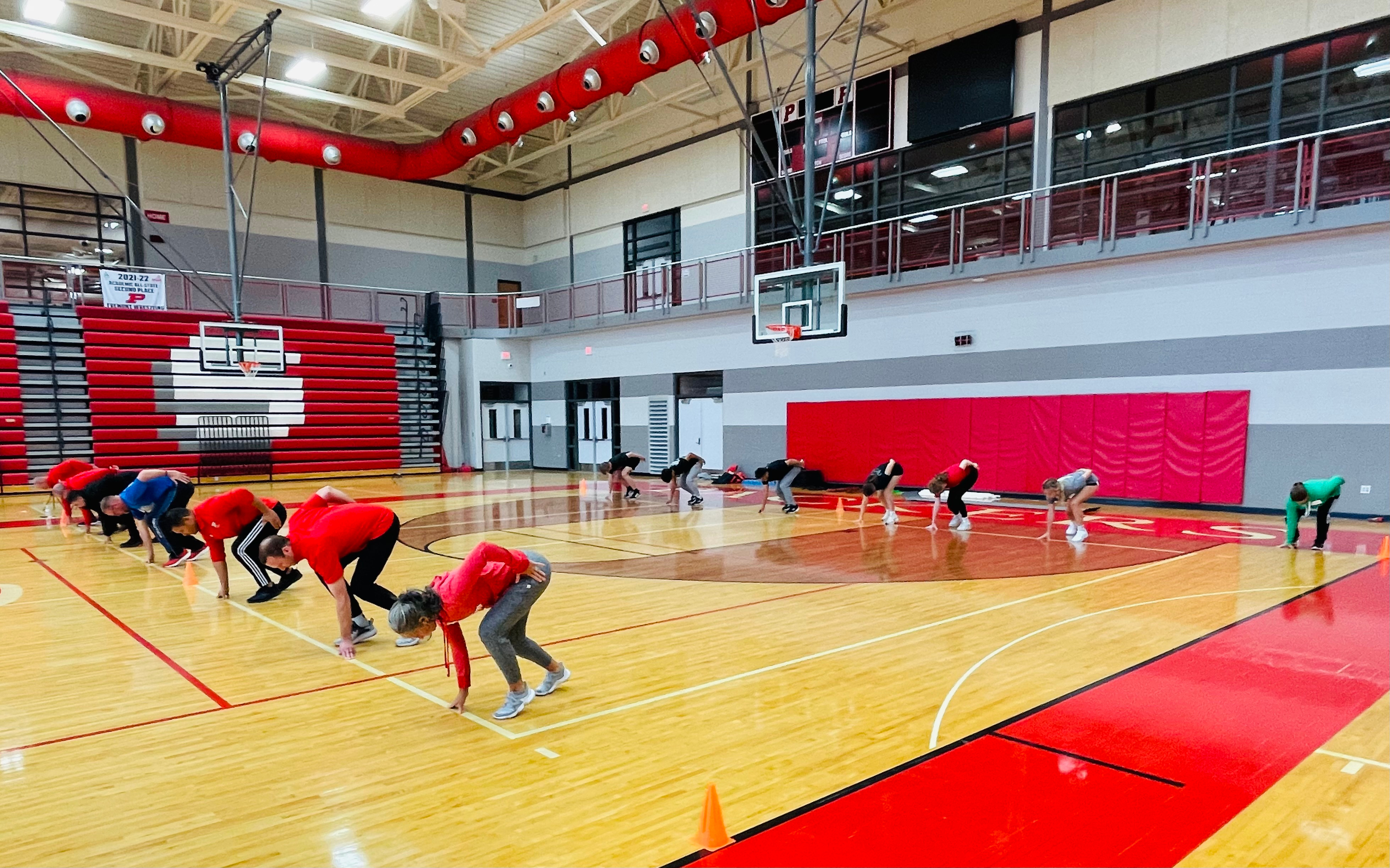 Coaches running through a group training session at a Coach Martens clinic