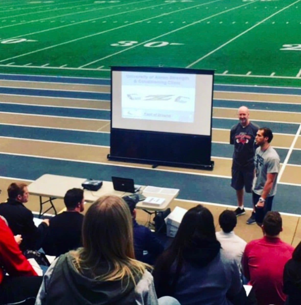 Coach Martens speaking at a university strength and conditioning clinic